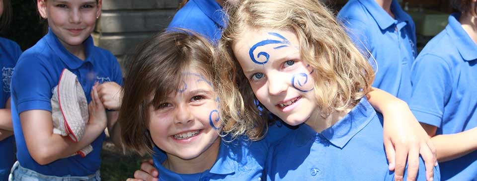 Two girls with Celtic warrior face paint on