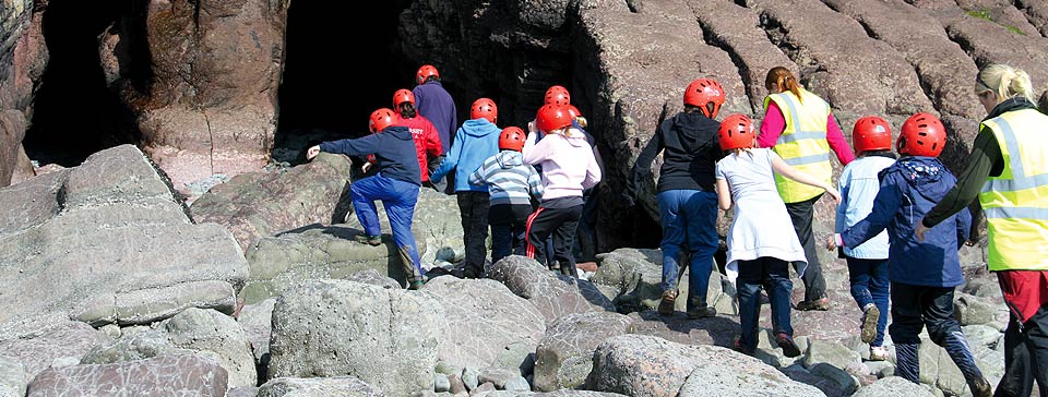 Children safely entering caves